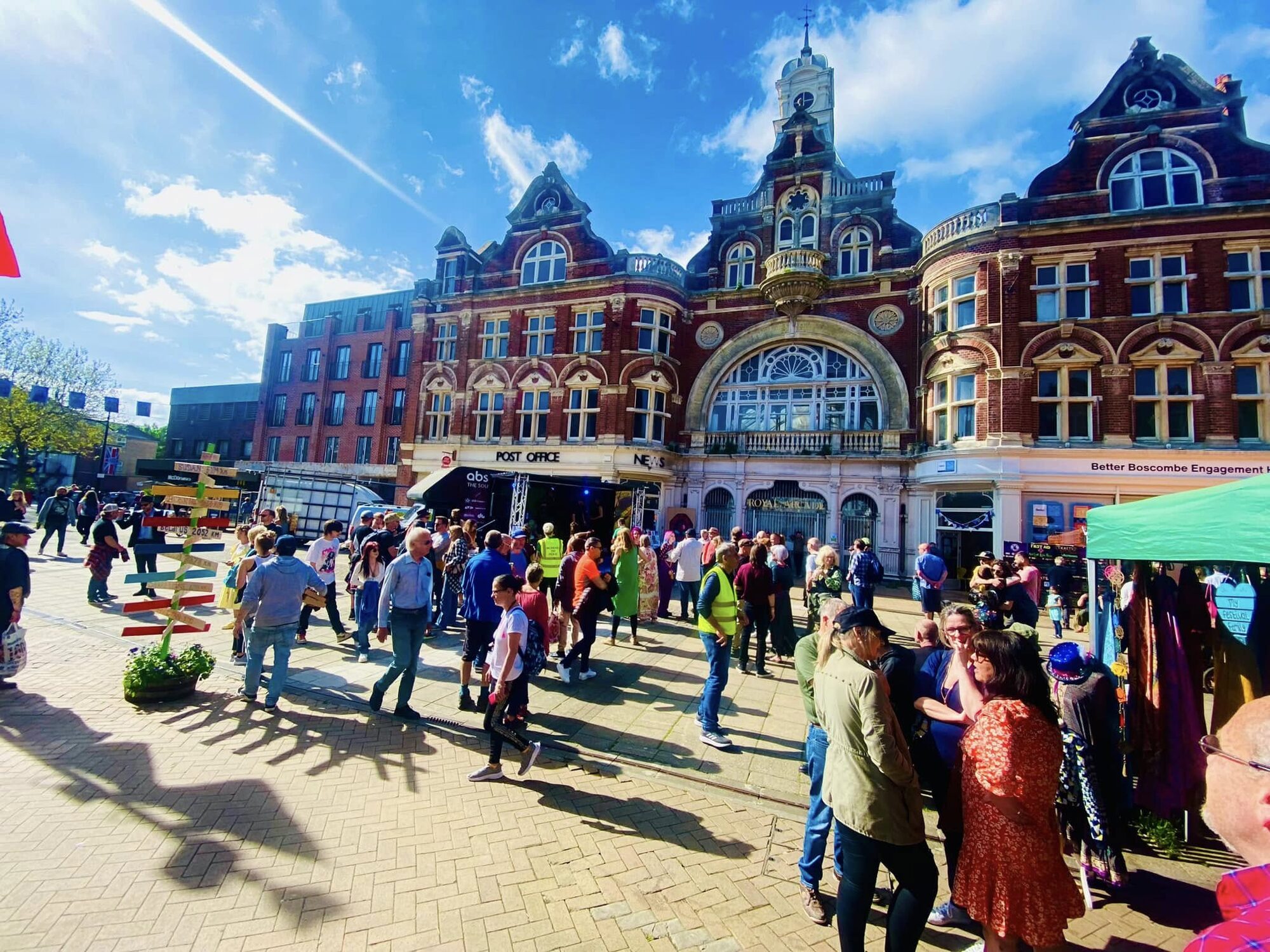 Increase the Peace — crowds outside the Royal Arcade on a sunny afternoon